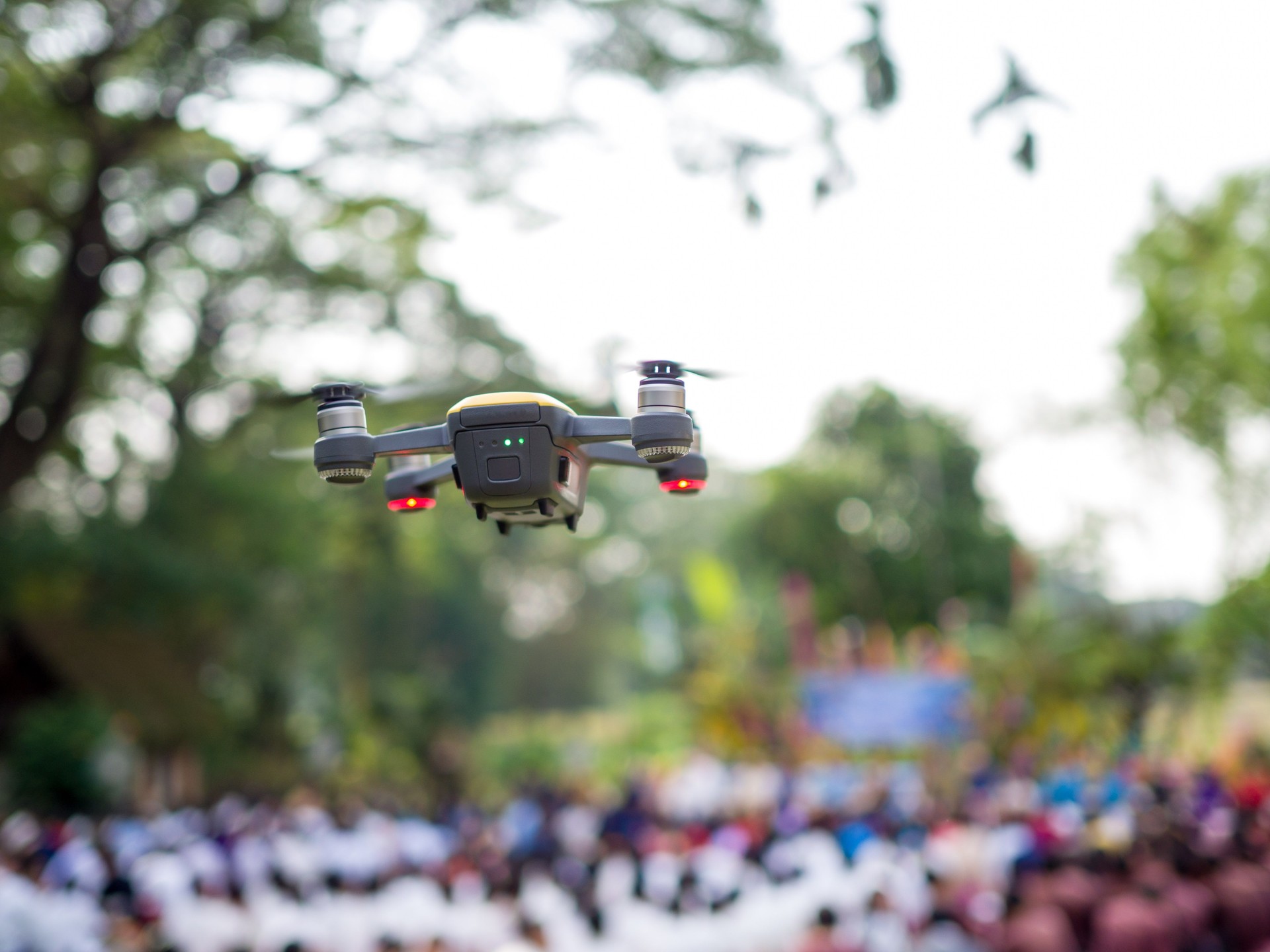 Drone flying for taking video of crowd